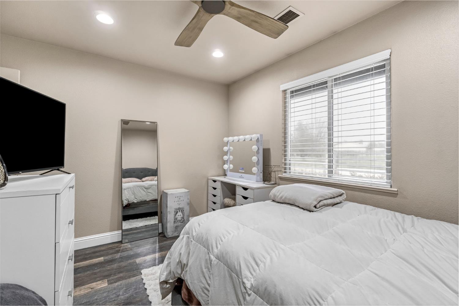 25802 El Monte Way Madera, CA 93638 - Photo 21 of 39 bedroom featuring dark wood-style flooring, a ceiling fan, recessed lighting, and a textured wall