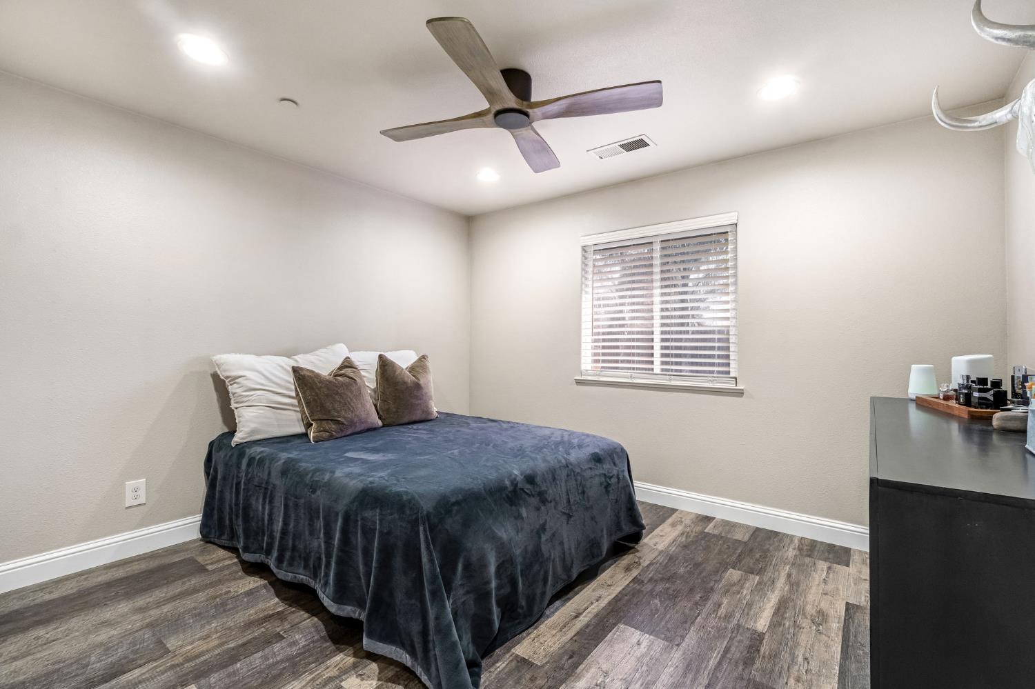 25802 El Monte Way Madera, CA 93638 - Photo 23 of 39 bedroom featuring dark wood finished floors, ceiling fan, and recessed lighting
