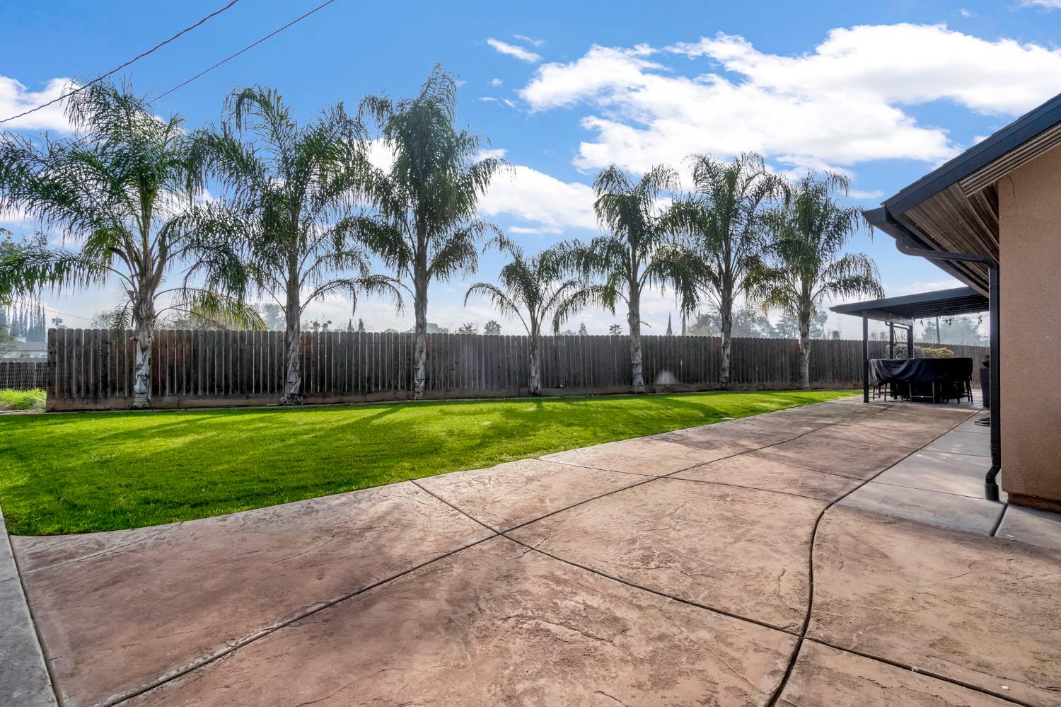 25802 El Monte Way Madera, CA 93638 - Photo 26 of 39 fenced backyard with a patio area