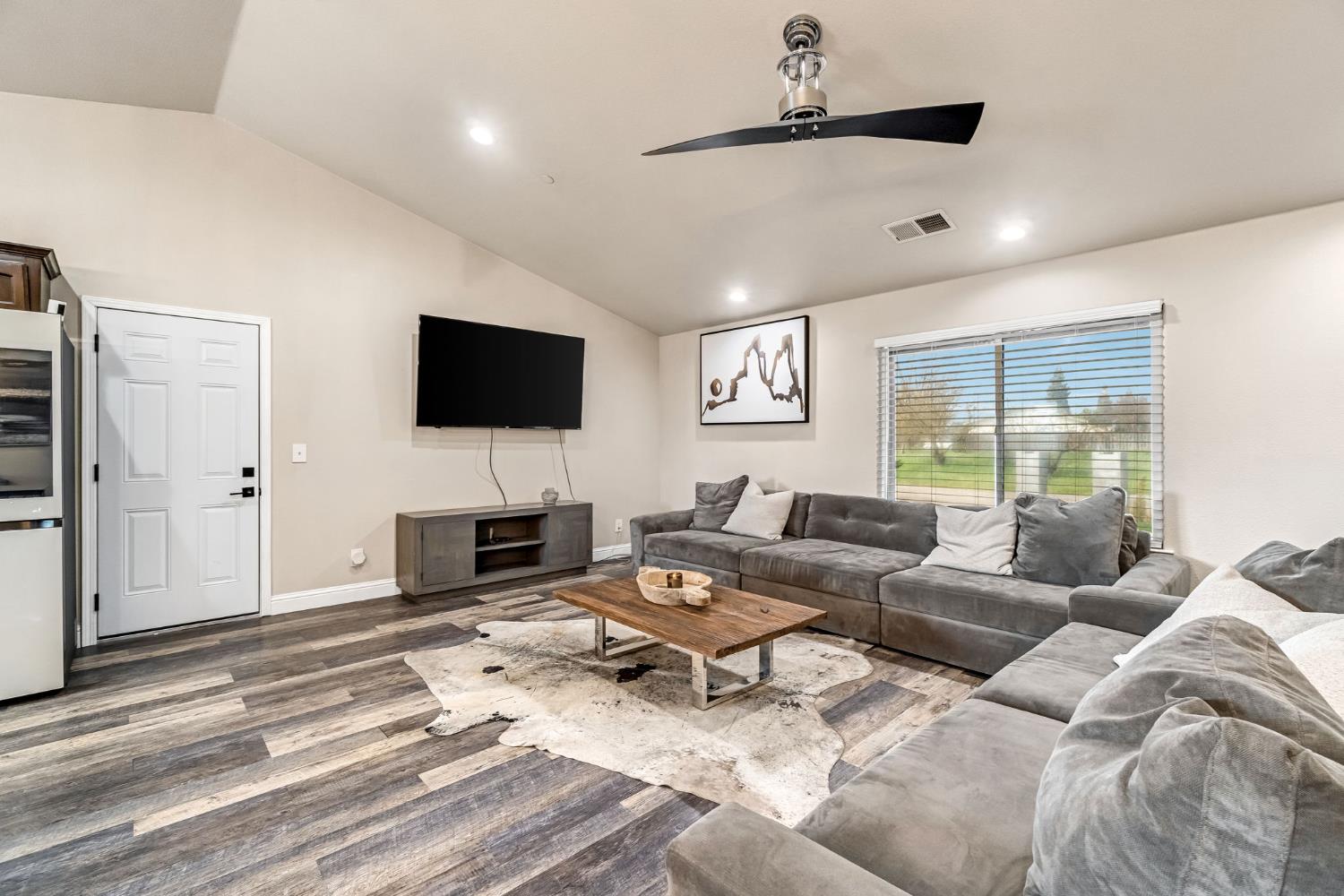 25802 El Monte Way Madera, CA 93638 - Photo 6 of 39 living area featuring a ceiling fan, wood finished floors, vaulted ceiling, and recessed lighting