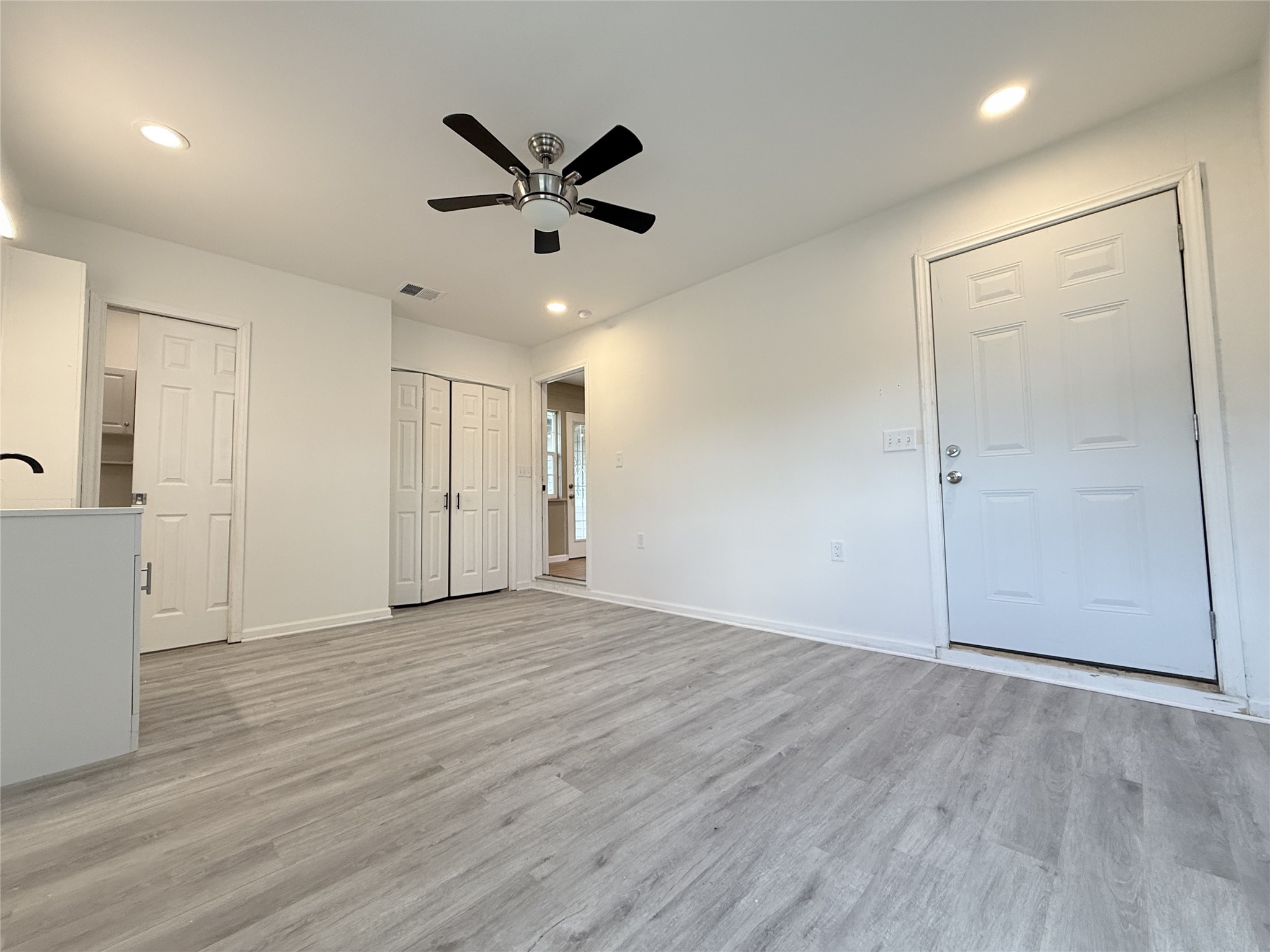 1922 Tabor Street Houston, TX 77009 - Photo 10 of 24 Beyond the door on the right is a cozy, paved patio & gate to the carport.