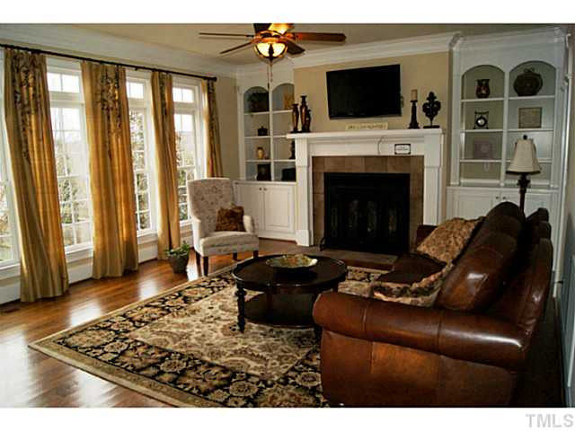 Gleaming hardwoods and beautiful wall of windows overlooks spacious back yard. Den/Family/Great Room
