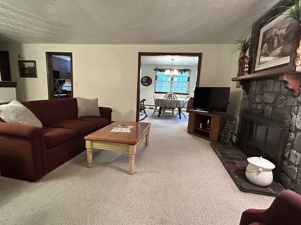 58 Summer Hill Road Maynard, MA 01754 - Photo 6 of 15 a living room with furniture and a fireplace