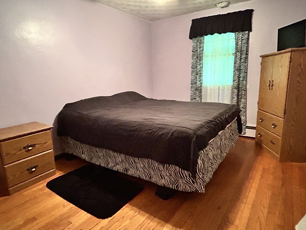 58 Summer Hill Road Maynard, MA 01754 - Photo 10 of 15 a bedroom with a bed dresser and a window