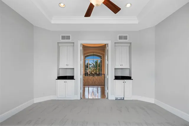 a kitchen with a sink a stove and cabinets