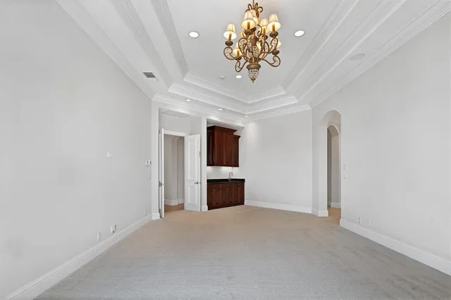 a large bathroom with a large tub and sink