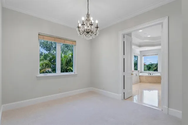 a bathroom with a bathtub and next to a window