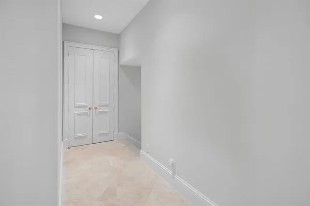a bathroom with a granite countertop sink a toilet and a mirror