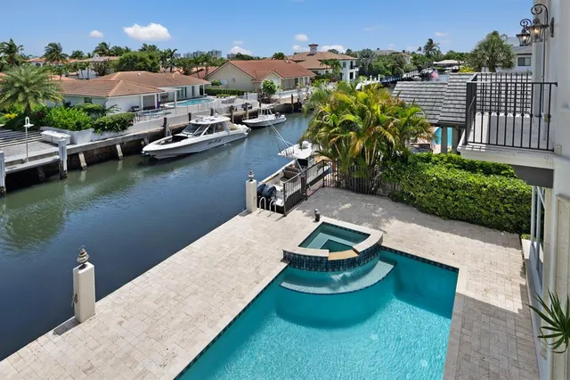 a front view of a house with yard and mountain view in back