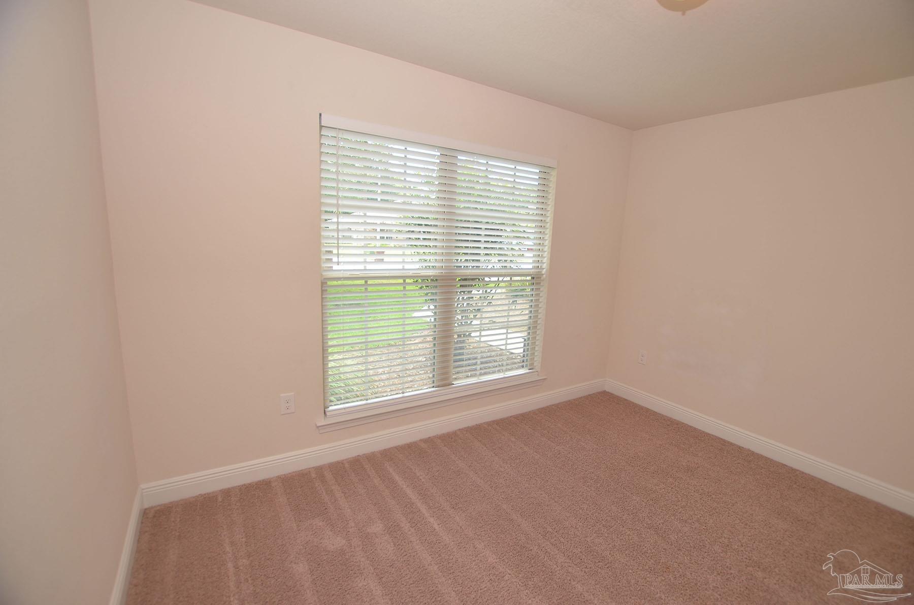 5709 Mill Stream Way Pace, FL 32571 - Photo 40 of 48 an empty room with a window