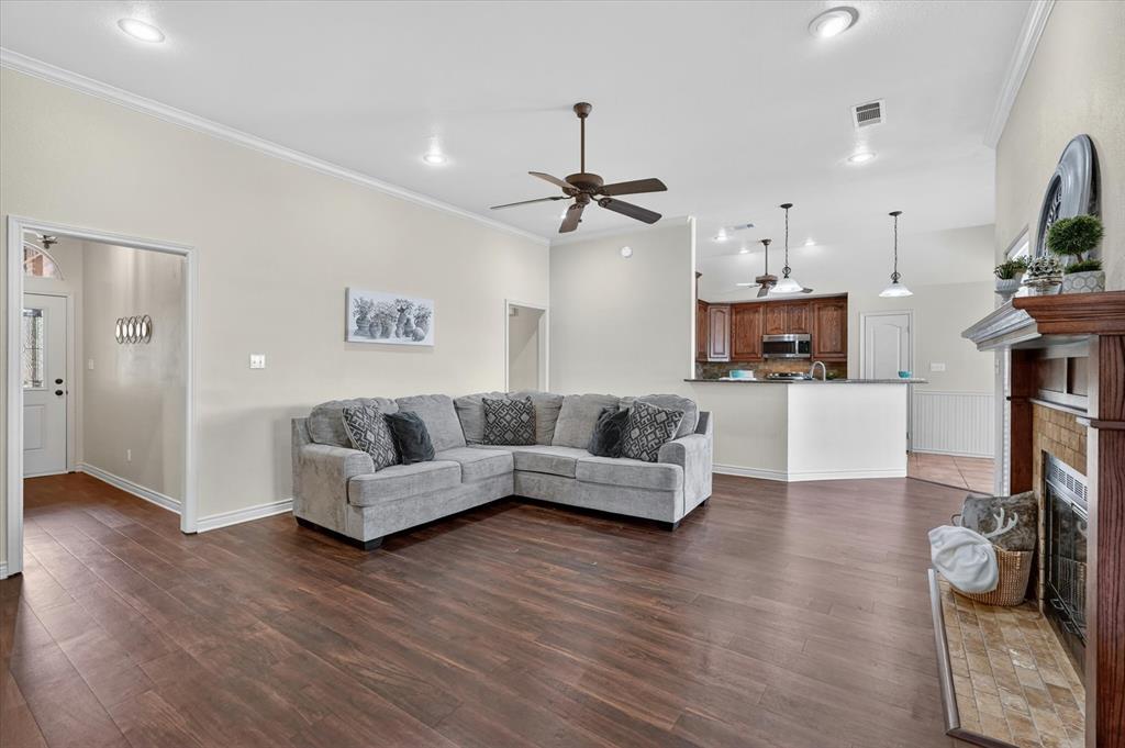 2828 Bennett Road Howe, TX 75459 - Photo 6 of 39 a living room with furniture and a wooden floor