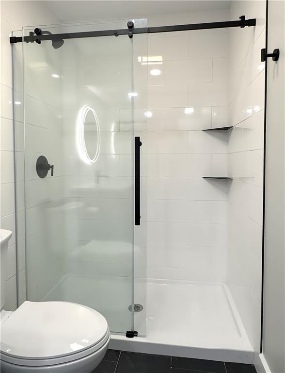 422 Walnut Street, Unit 2 Sewickley, PA 15143 - Photo 12 of 12 a bathroom with a shower a toilet and a shower