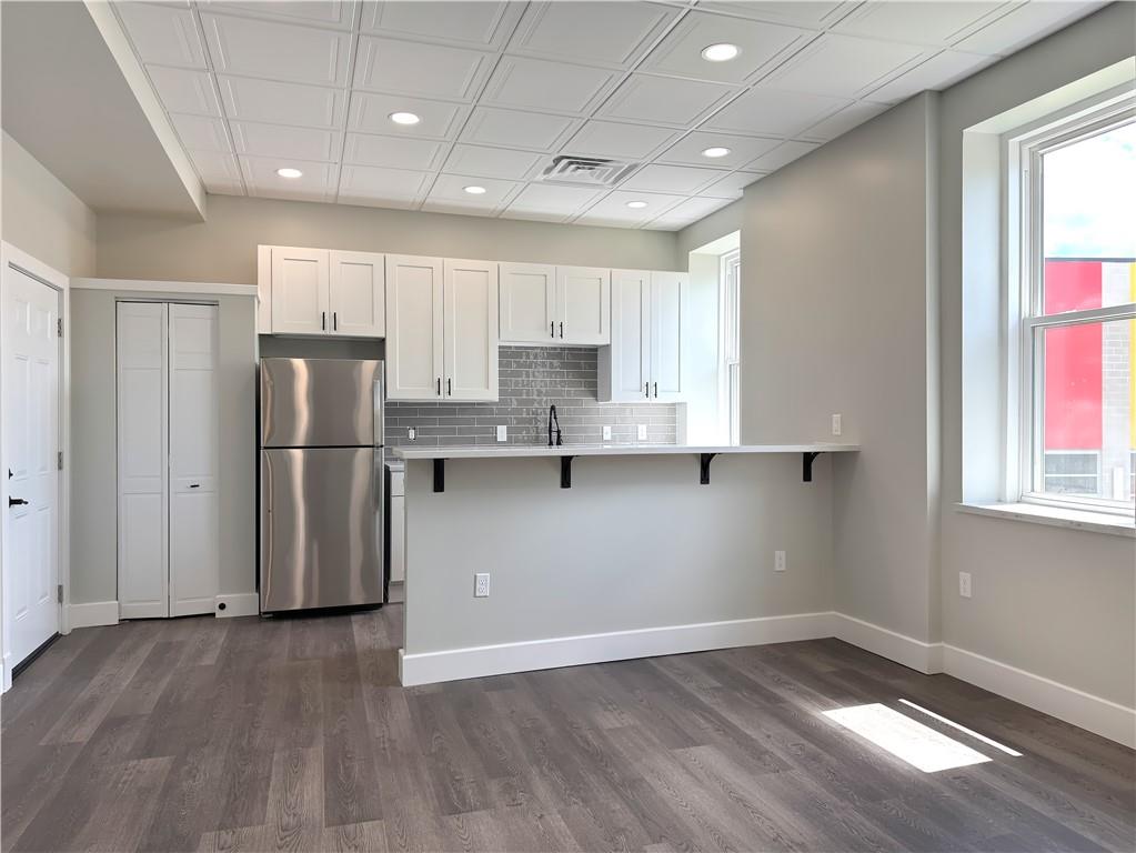 422 Walnut Street, Unit 2 Sewickley, PA 15143 - Photo 2 of 12 a view of kitchen with stainless steel appliances refrigerator stove top oven and cabinets
