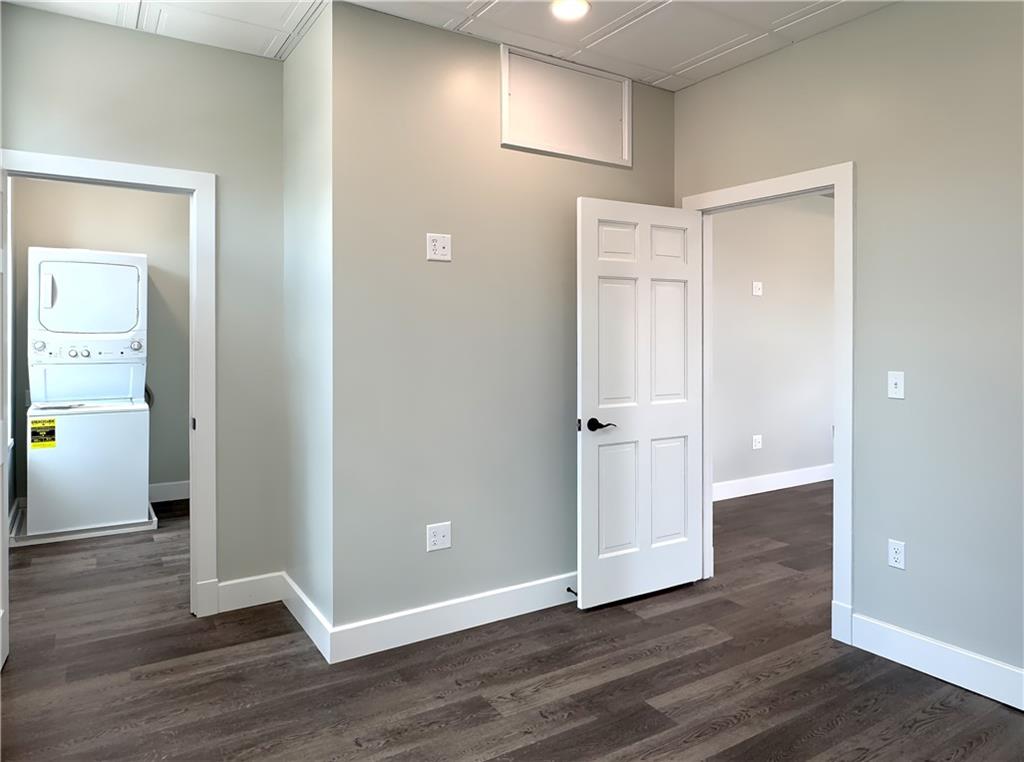422 Walnut Street, Unit 2 Sewickley, PA 15143 - Photo 9 of 12 an empty room with wooden floor and windows