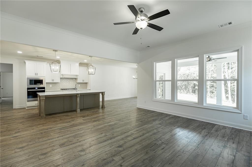 1210 Austin Road Winder, GA 30680 - Photo 24 of 56 a view of kitchen with cabinets and wooden floor