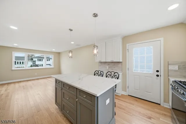 a view of a kitchen with electric appliances