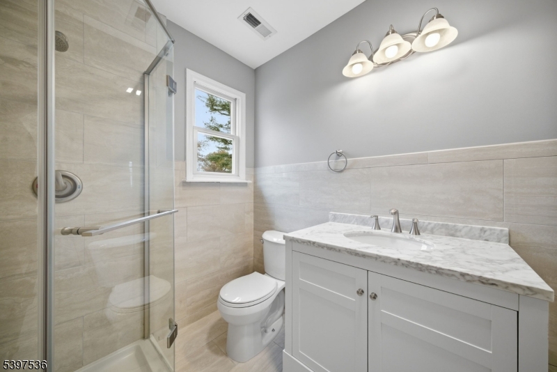 2535 Standish Avenue Union, NJ 07083 - Photo 17 of 45 a bathroom with a sink a toilet and shower