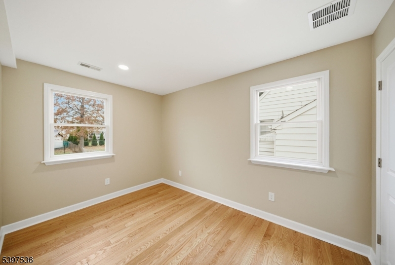 2535 Standish Avenue Union, NJ 07083 - Photo 21 of 45 a view of an empty room with wooden floor and a window