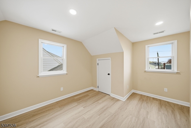 2535 Standish Avenue Union, NJ 07083 - Photo 31 of 45 a view of an empty room with wooden floor and a window