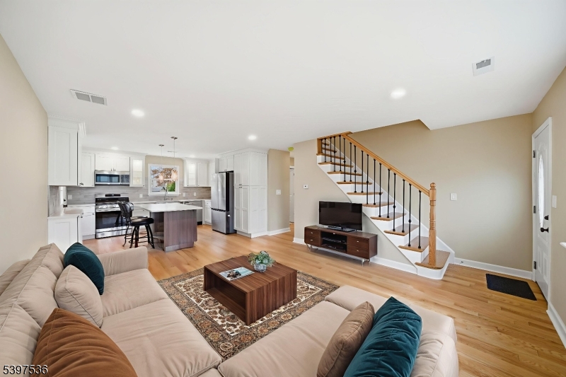 2535 Standish Avenue Union, NJ 07083 - Photo 5 of 45 a living room with furniture kitchen view and a fireplace