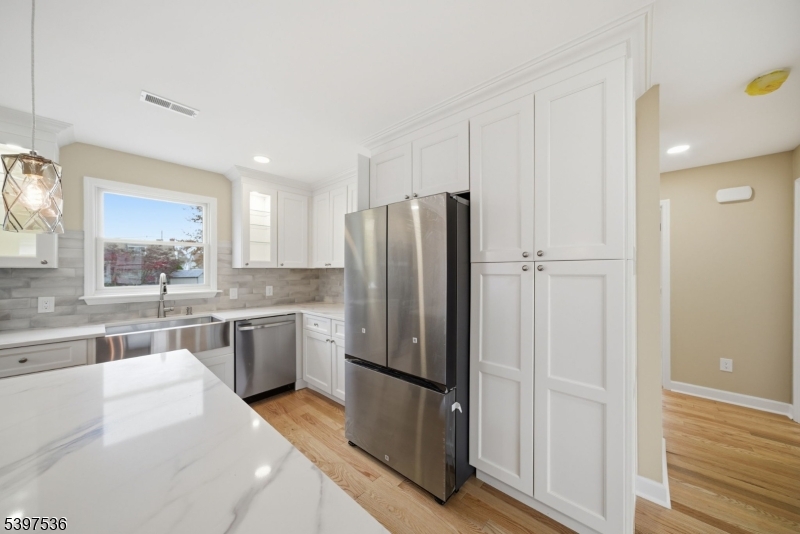 2535 Standish Avenue Union, NJ 07083 - Photo 10 of 45 a kitchen with a refrigerator and a sink