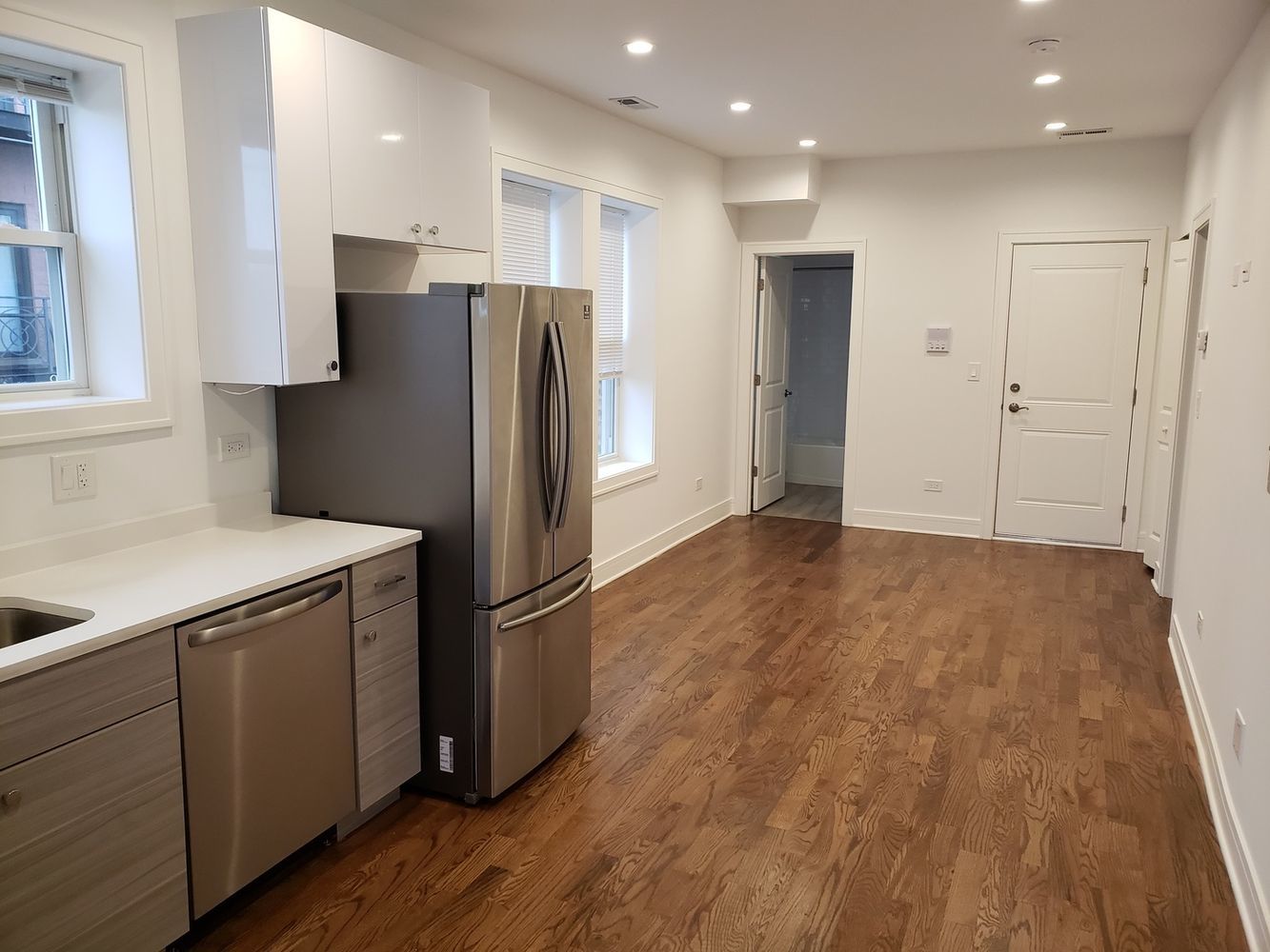 2347 West Taylor Street, Unit 3R Chicago, IL 60612 - Photo 2 of 9 a kitchen with stainless steel appliances granite countertop a refrigerator and a sink
