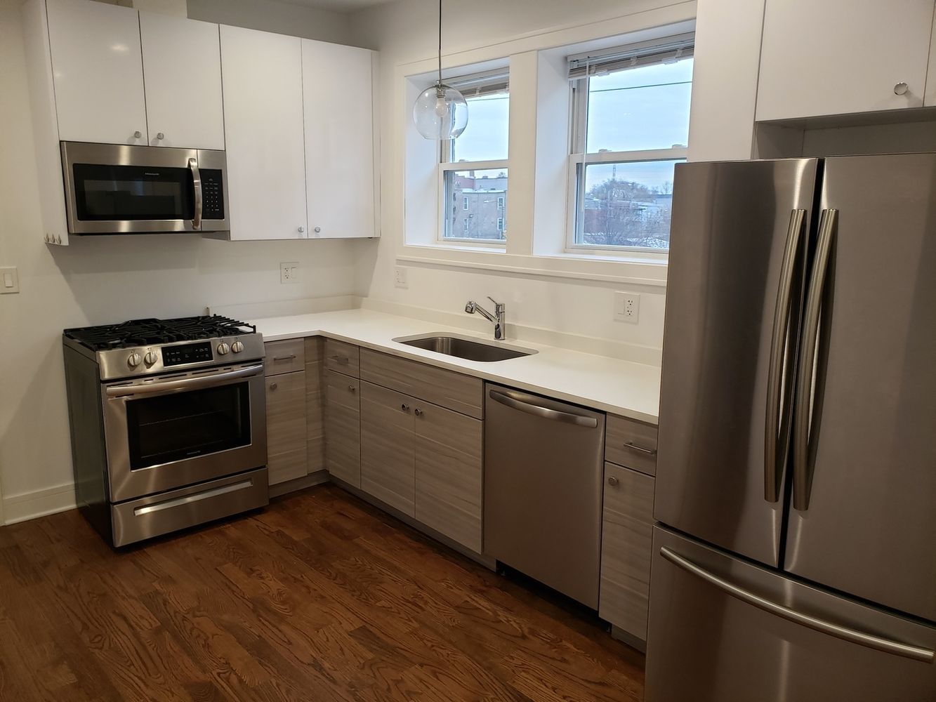 2347 West Taylor Street, Unit 3R Chicago, IL 60612 - Photo 3 of 9 a kitchen with stainless steel appliances a stove a refrigerator and a sink