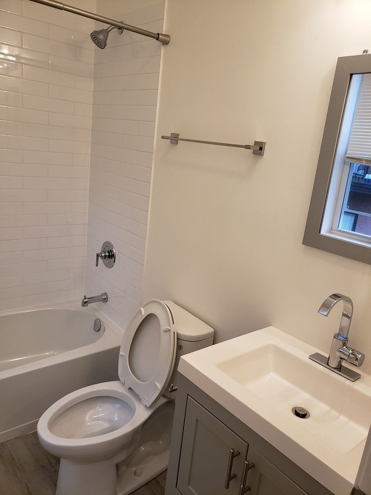 2347 West Taylor Street, Unit 3R Chicago, IL 60612 - Photo 6 of 9 a bathroom with a sink toilet and shower