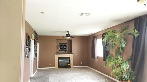 a view of entryway and kitchen