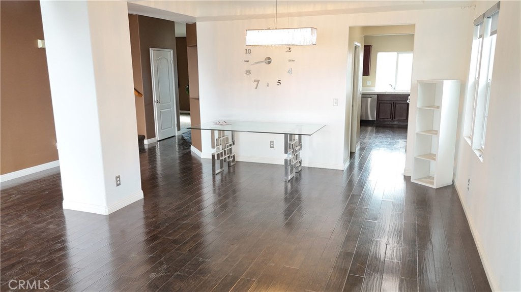 176 Nightfall Road San Jacinto, CA 92582 - Photo 5 of 11 an entryway with wooden floor and a view of bathroom