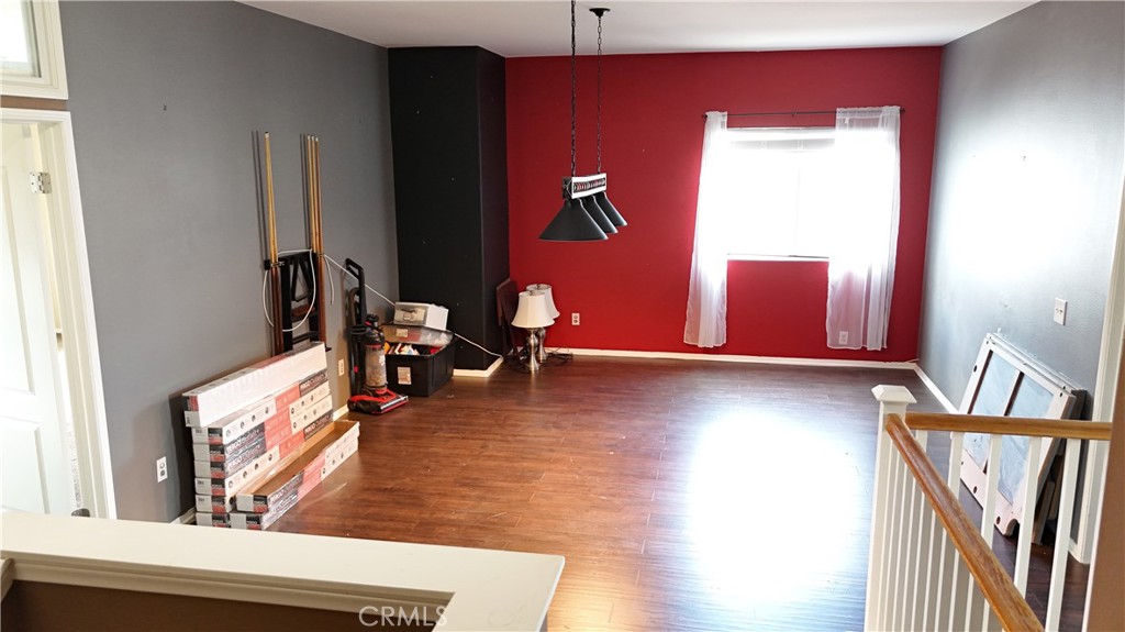 176 Nightfall Road San Jacinto, CA 92582 - Photo 9 of 11 a view of a living room with furniture and wooden floor