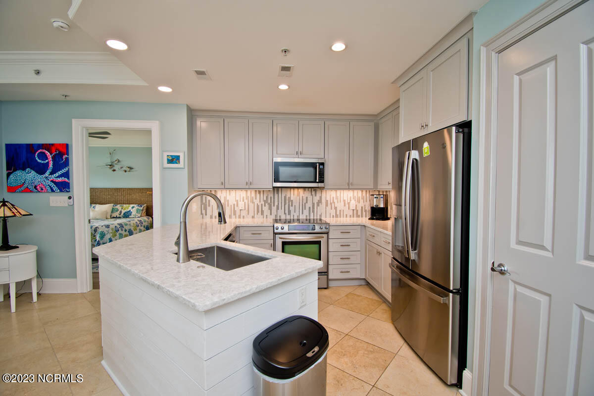 1435 Salter Path Road, Unit I 2 Indian Beach, NC 28512 - Photo 35 of 54 New in 2021: GE Profile Refrigerator-22.1 Cu ft, Fans upgraded w remote controls. LVP in both bedrooms, 2 new 17'' Kohler toilets, new stainless Kitchen Aid dishwasher, and new canned lighting throughout.