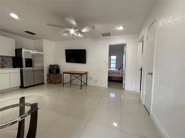 a kitchen with stainless steel appliances a stove a sink and a microwave