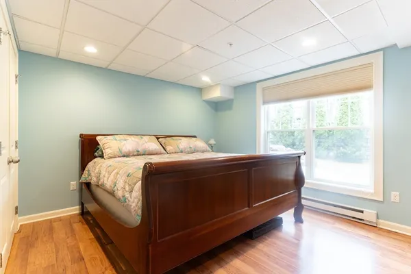a bedroom with a bed and window