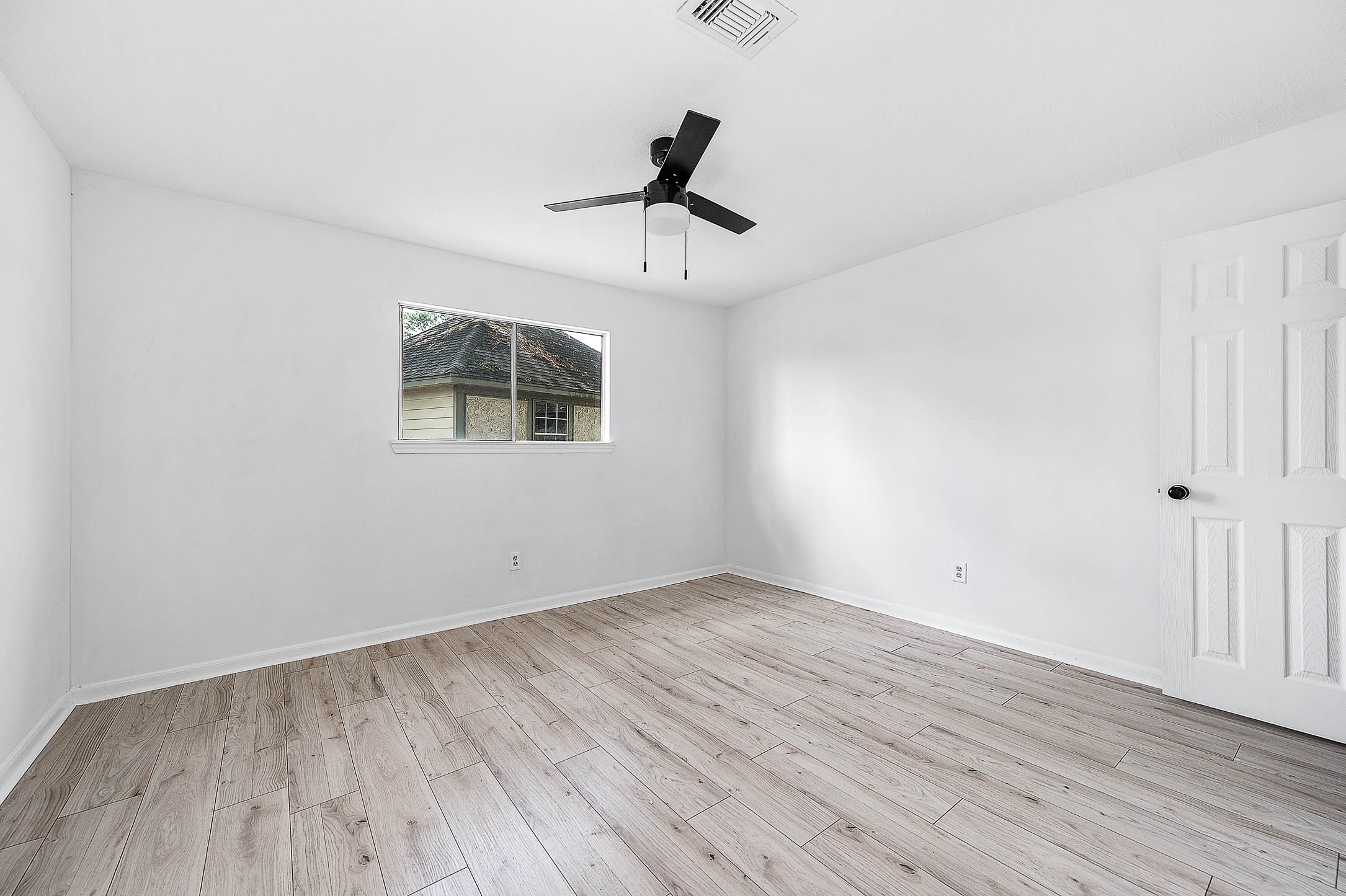 17627 Terrawren Lane Spring, TX 77379 - Photo 24 of 30 wooden floor in an empty room with a window