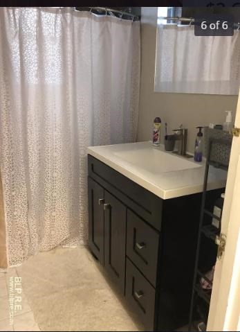 1490 Beacon Street, Unit 2 Brookline, MA 02446 - Photo 6 of 6 a bathroom with a sink and a mirror