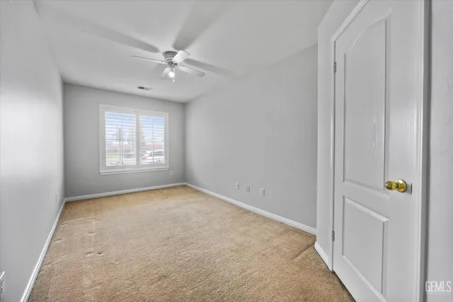 an empty room that has a window in it