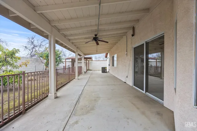 a view of empty room with wooden walls
