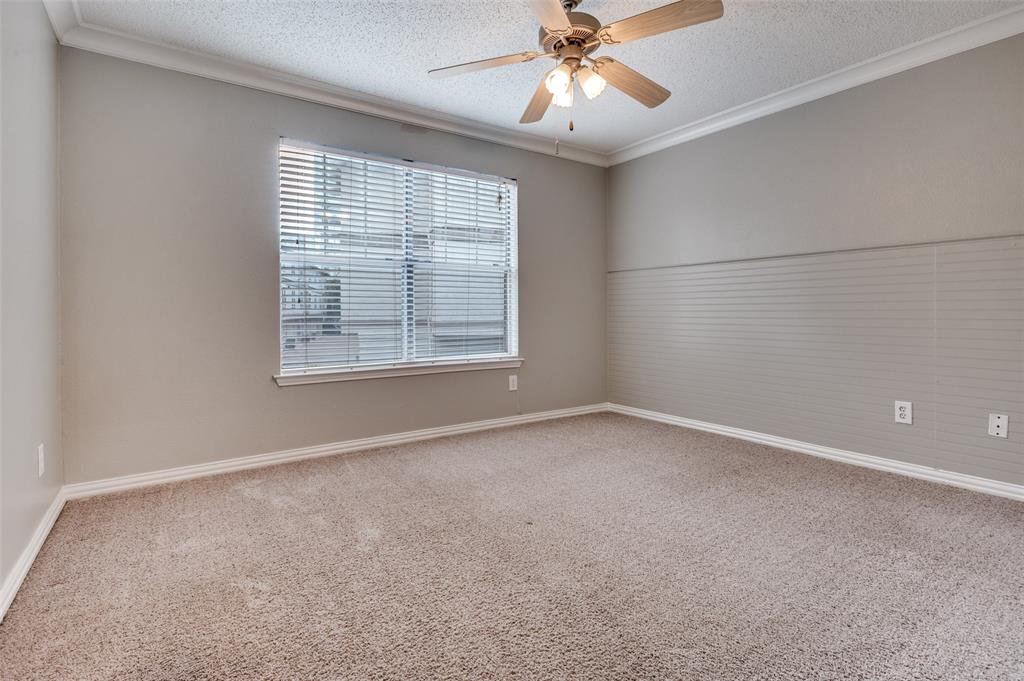 2201 Wolf Street, Unit 5107 Dallas, TX 75201 - Photo 14 of 21 an empty room with a window and a fan