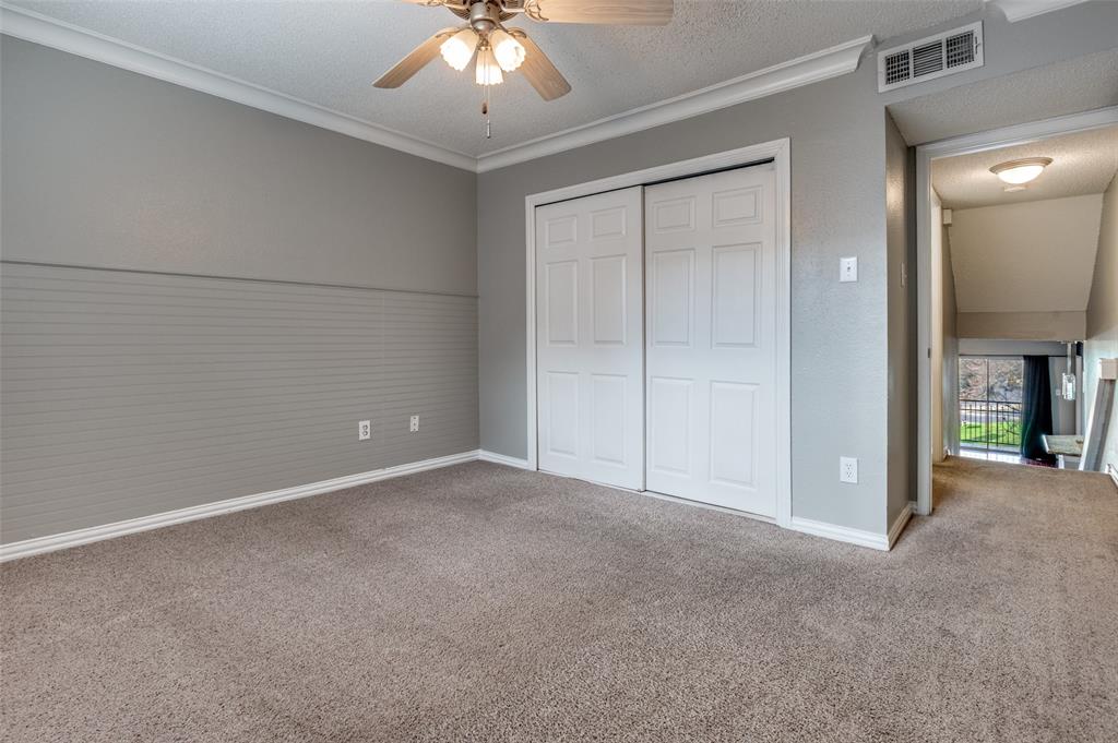 2201 Wolf Street, Unit 5107 Dallas, TX 75201 - Photo 15 of 21 an empty room with chandelier fan