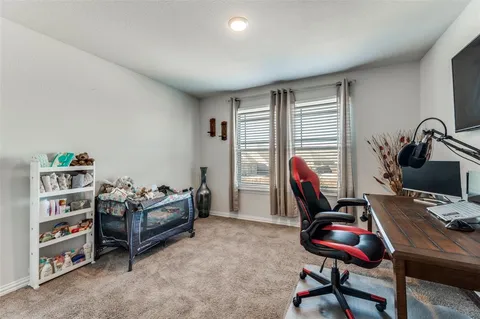 a workspace with furniture and a window