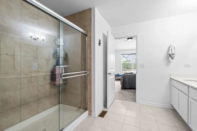 a view of walk in closet with clothes