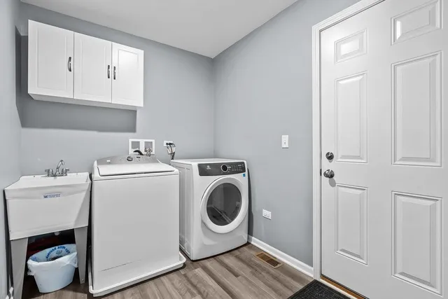 a bedroom with a bed a mirror and glass door