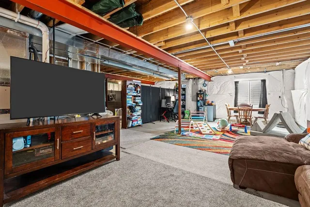 a view of a patio with a dining table and chairs with wooden floor