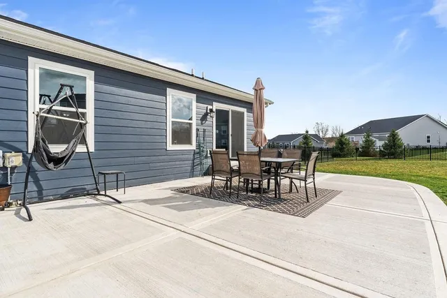 a view of a street with a big yard