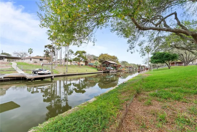 a view of a lake with houses in all around