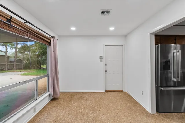 a view of hallway with a large window