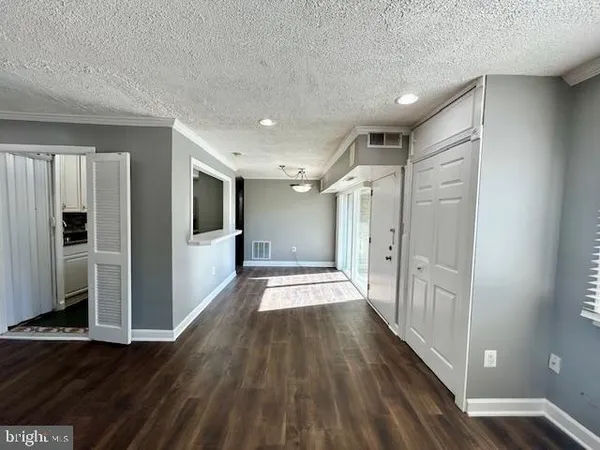 a view of gallery with wooden floor