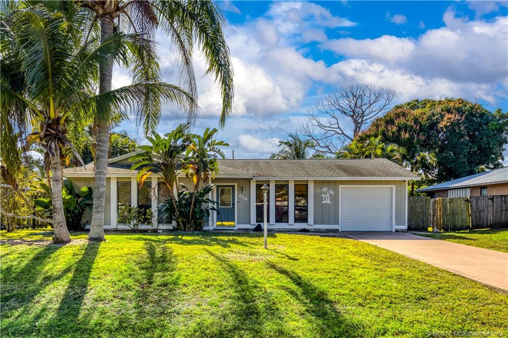 a view of a house with swimming pool and porch
