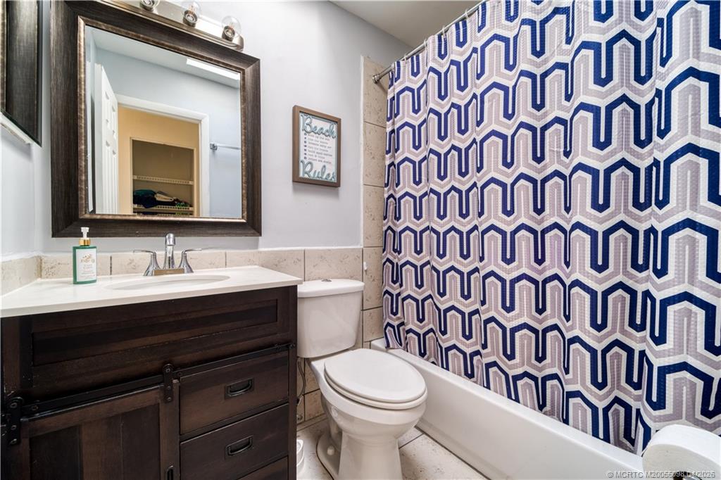 656 Southeast Ron Rico Terrace Port St. Lucie, FL 34983 - Photo 12 of 20 a bathroom with a sink and a toilet